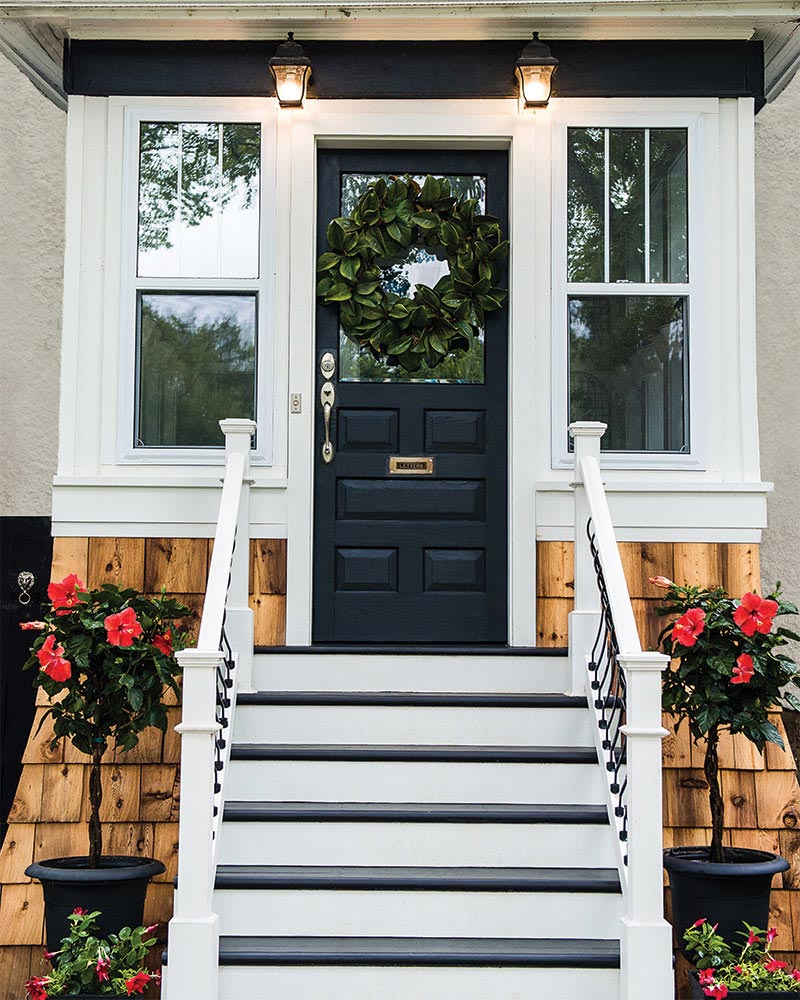 Modern Farmhouse Front Porch with Heritage Door and Red Hibiscus plants