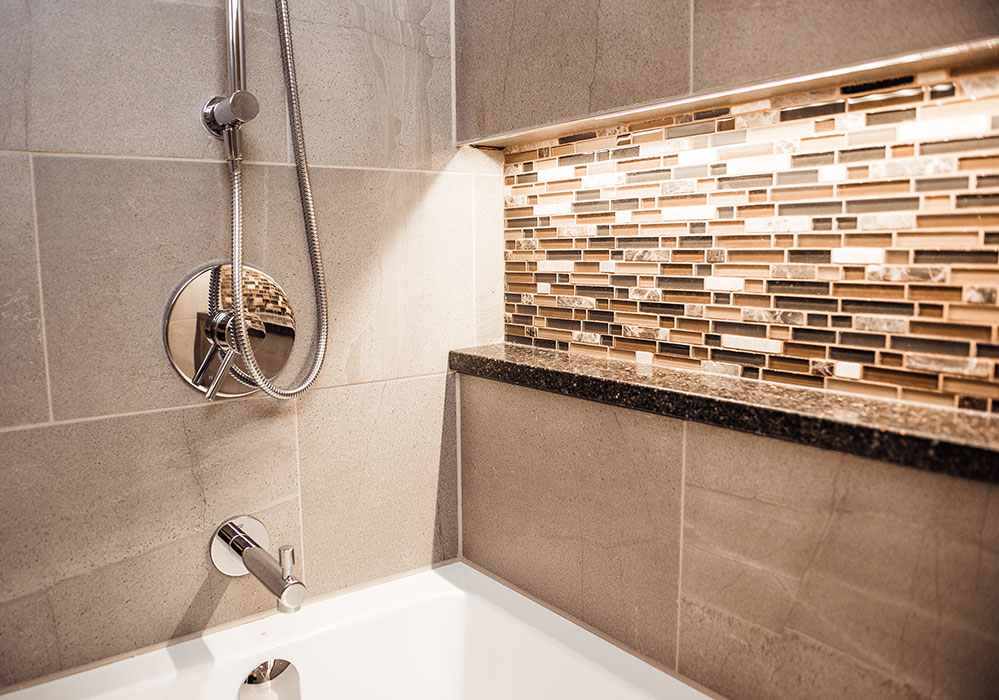 Brown Bathroom tile accent wall with lighting