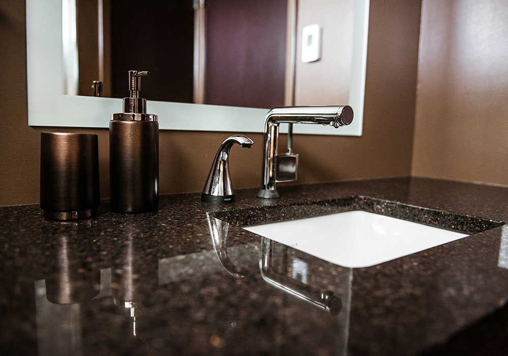 Detail of brown countertop and white sink