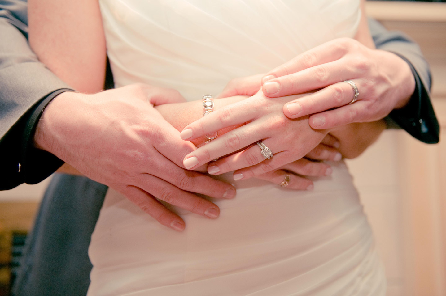Bride and Groom with lovingly clasped hands