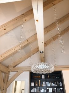 Medical Clinic Pine wood ceiling beams and glass chandelier